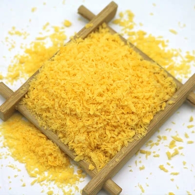 Flockiger knusperiger knuspriger gelber Japaner Panko blättert gebackener Brot-Geruch ab